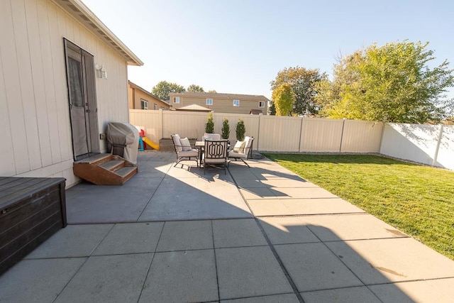 view of patio / terrace with area for grilling and a fenced backyard