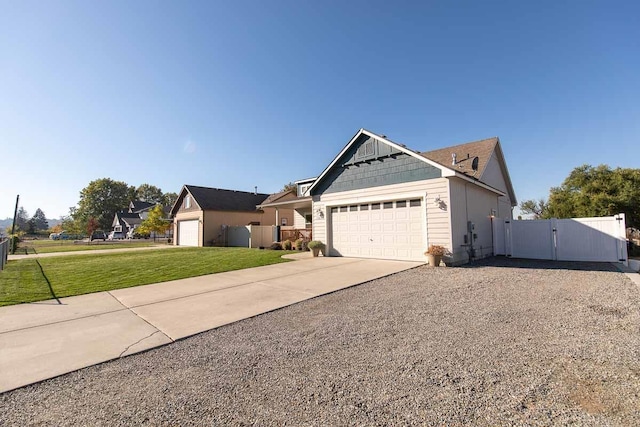 view of front of home featuring a gate, fence, concrete driveway, a front lawn, and a garage