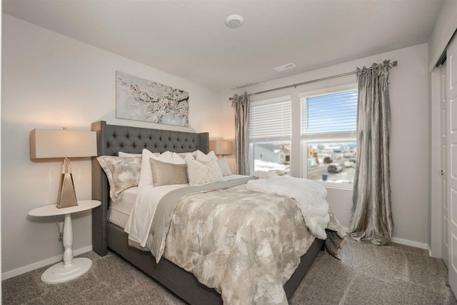 bedroom featuring visible vents, carpet floors, baseboards, and a closet