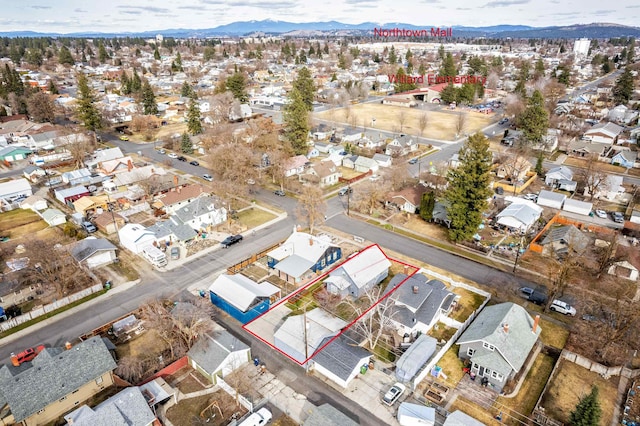 birds eye view of property with a mountain view and a residential view