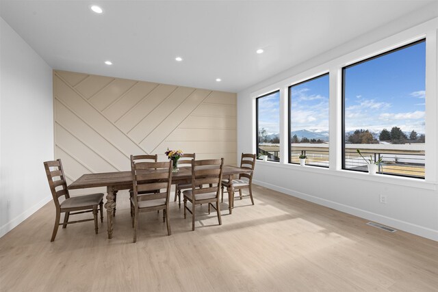 unfurnished living room featuring recessed lighting, light wood-style floors, visible vents, and a large fireplace