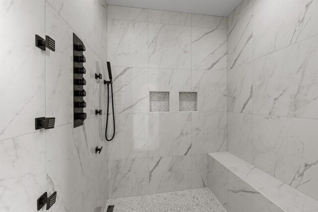 bathroom featuring visible vents, baseboards, marble finish floor, and vanity