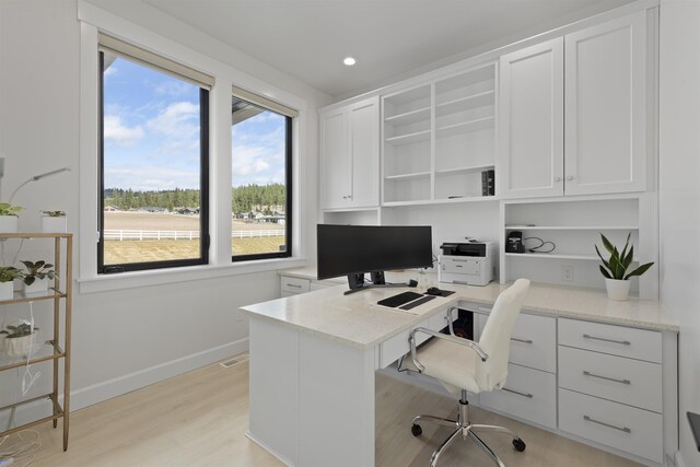 spare room with recessed lighting, visible vents, baseboards, and light wood-style flooring