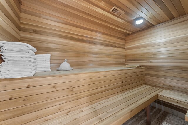 interior space featuring visible vents, marble finish floor, connected bathroom, and baseboards