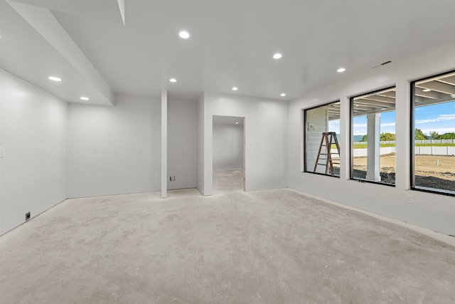 unfurnished room featuring recessed lighting and unfinished concrete flooring