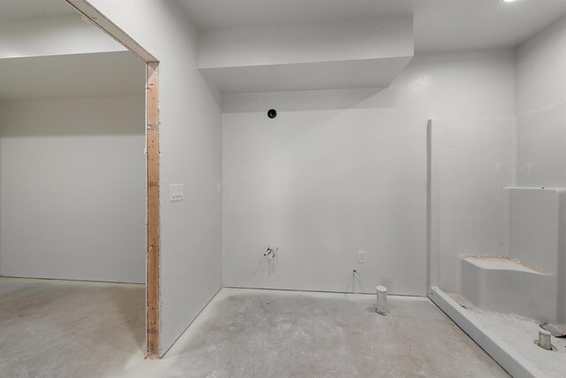 bathroom with concrete flooring