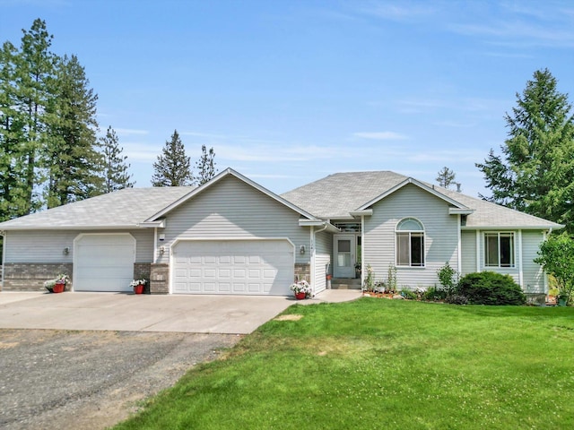 ranch-style house featuring driveway, a front yard, and an attached garage