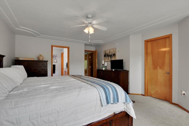 bedroom featuring a ceiling fan, light colored carpet, and baseboards