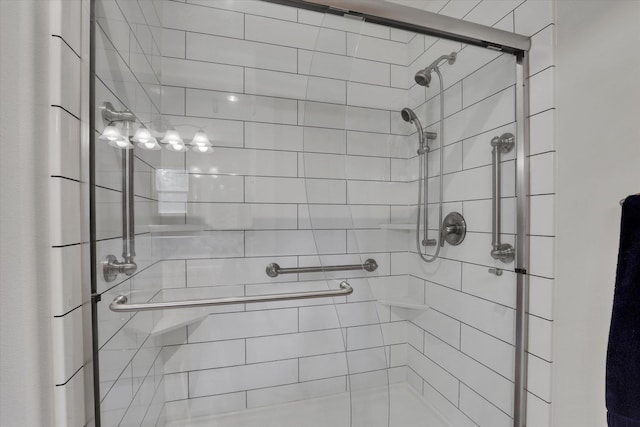 full bath featuring a shower stall