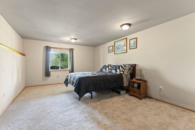 carpeted bedroom with baseboards