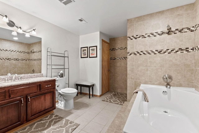 bathroom with vanity, a bath, visible vents, tile patterned flooring, and toilet