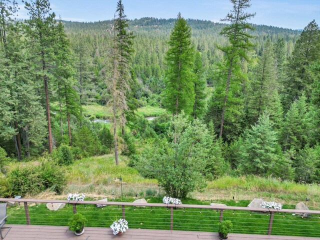 exterior space featuring a wooded view