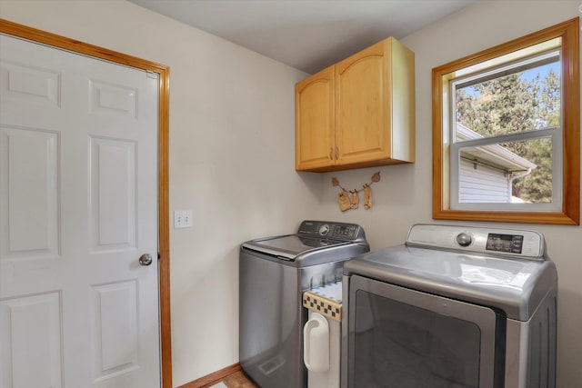 laundry area featuring cabinet space and separate washer and dryer