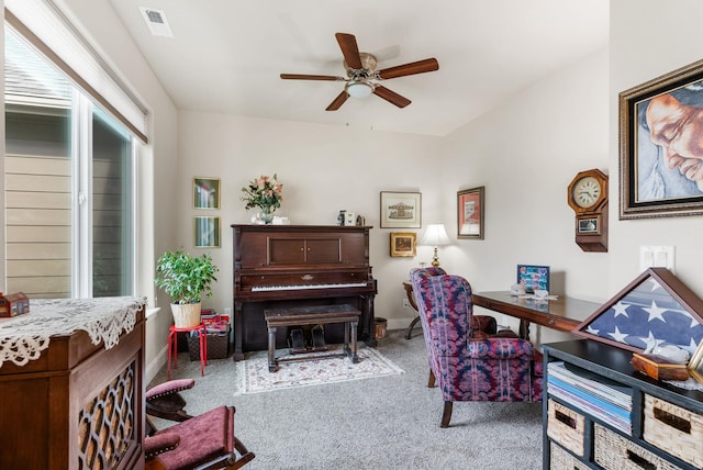 home office with visible vents, carpet flooring, baseboards, and ceiling fan