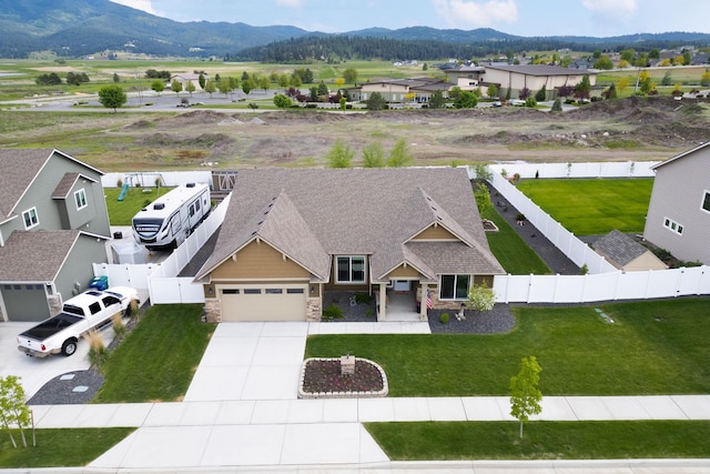 drone / aerial view featuring a residential view and a mountain view