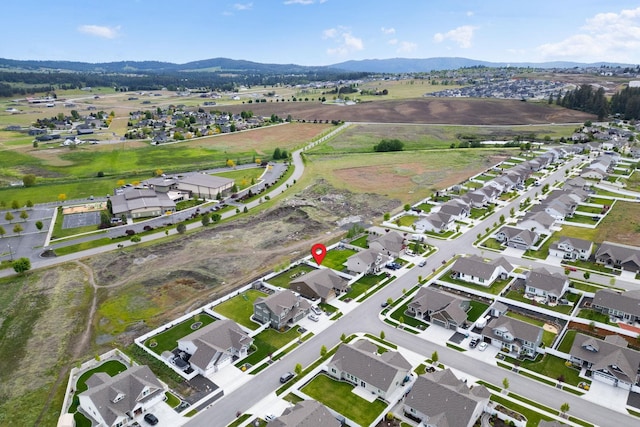 aerial view featuring a mountain view and a residential view