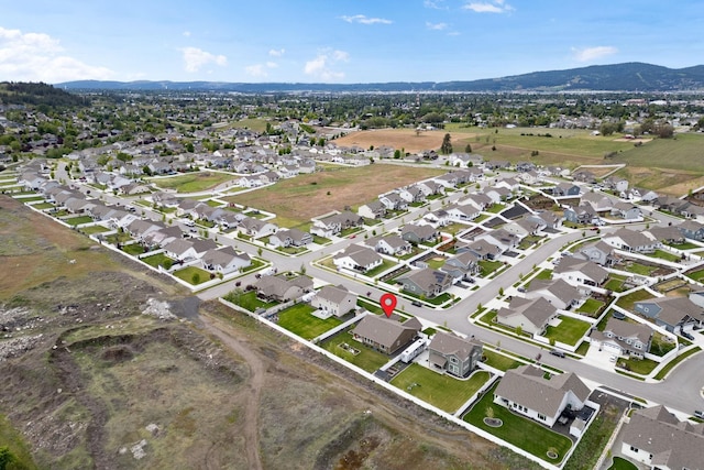 aerial view featuring a mountain view and a residential view