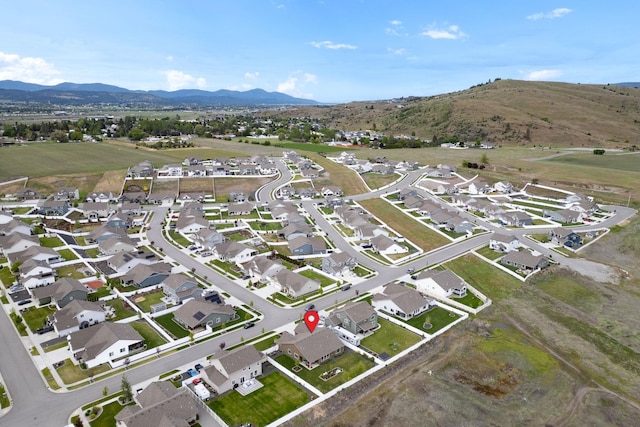 aerial view featuring a mountain view and a residential view