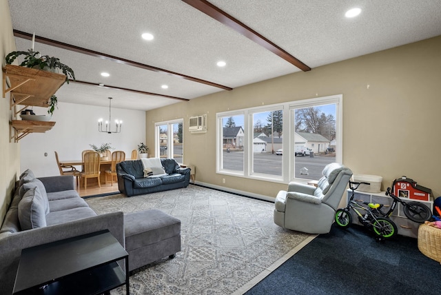 living area featuring baseboards, recessed lighting, a textured ceiling, beamed ceiling, and a notable chandelier