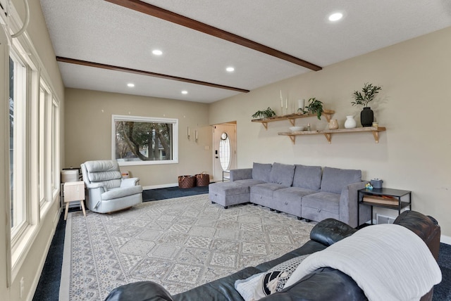 living area featuring recessed lighting, beam ceiling, and a textured ceiling