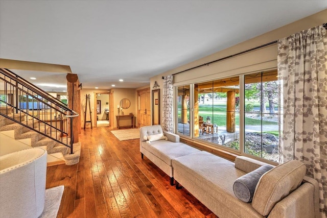 living area featuring stairway, recessed lighting, and wood-type flooring