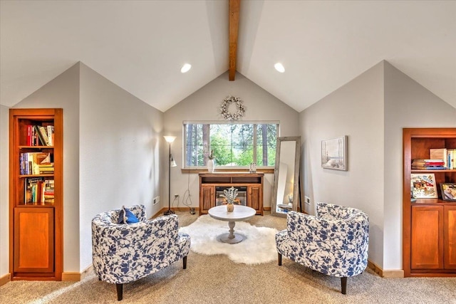 sitting room featuring vaulted ceiling with beams, carpet, and baseboards