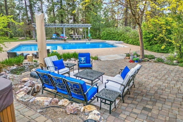 outdoor pool with an outdoor hangout area, a pergola, and a patio