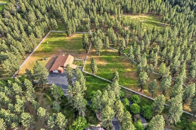 bird's eye view featuring a wooded view