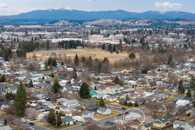 birds eye view of property featuring a mountain view