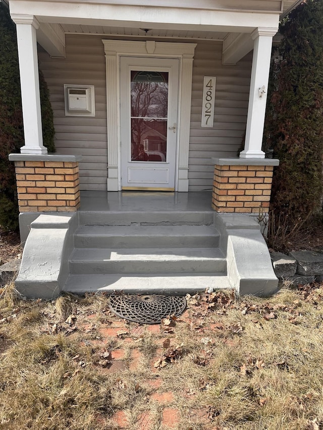 doorway to property featuring covered porch