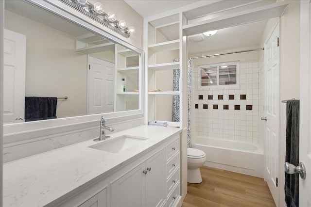 full bath with vanity, shower / bath combination with curtain, toilet, and wood finished floors