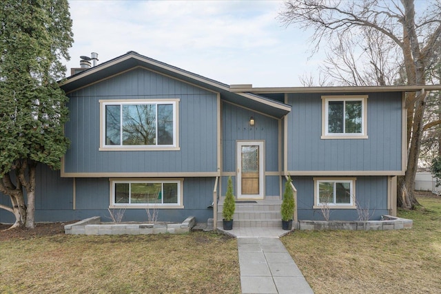 split foyer home with entry steps and a front yard