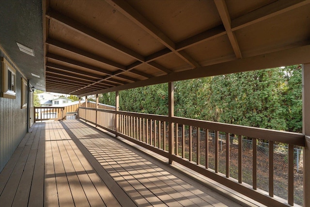 wooden deck featuring a forest view