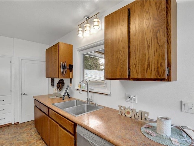 327 S Crosby St, Tekoa, WA 99033 - kitchen featuring a sink, brown cabinets, light countertops, dishwasher, and light stone finish floors