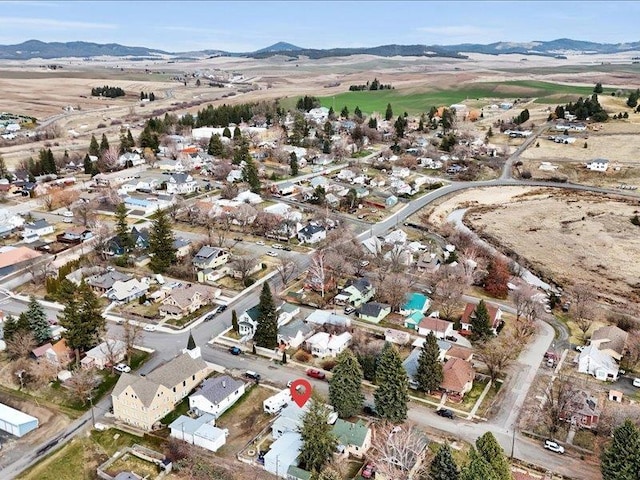 drone / aerial view with a residential view and a mountain view