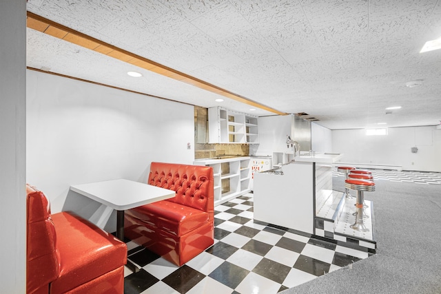 dining space featuring tile patterned floors, a textured ceiling, and recessed lighting