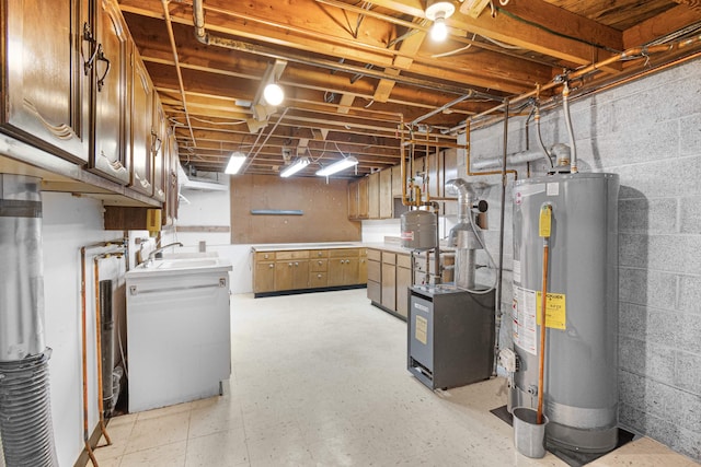 unfinished basement featuring gas water heater, a heating unit, and a sink