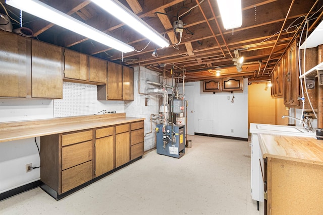 unfinished basement featuring ceiling fan and a sink