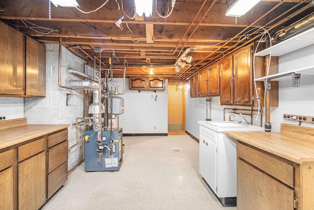 unfinished basement featuring a heating unit and a sink