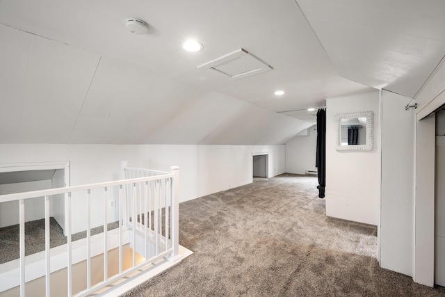 bonus room featuring vaulted ceiling, attic access, recessed lighting, and carpet