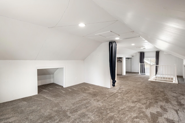 bonus room featuring carpet and vaulted ceiling