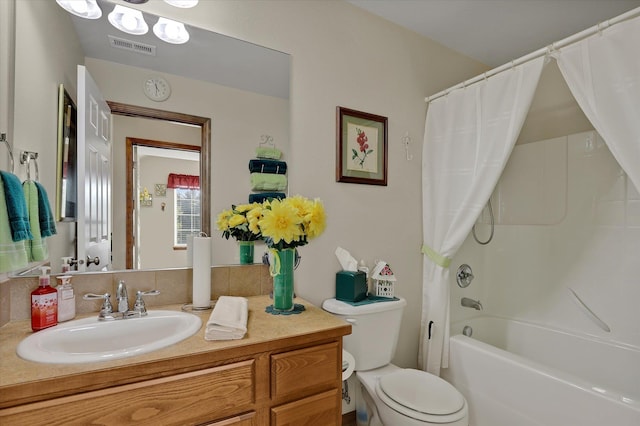 full bath with vanity, toilet, visible vents, and shower / tub combo with curtain