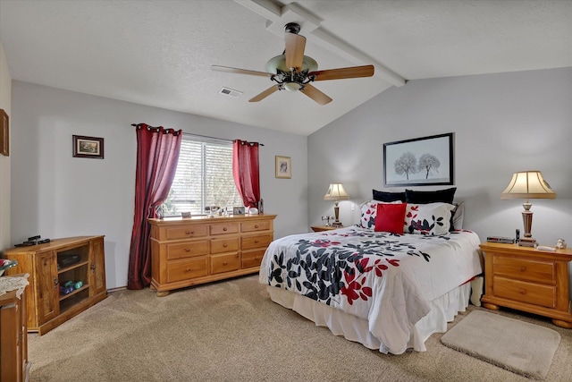 bedroom featuring visible vents, vaulted ceiling with beams, light carpet, a textured ceiling, and a ceiling fan