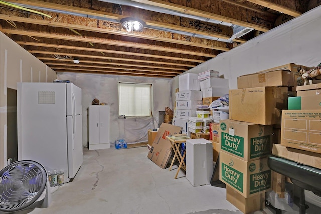 basement with freestanding refrigerator