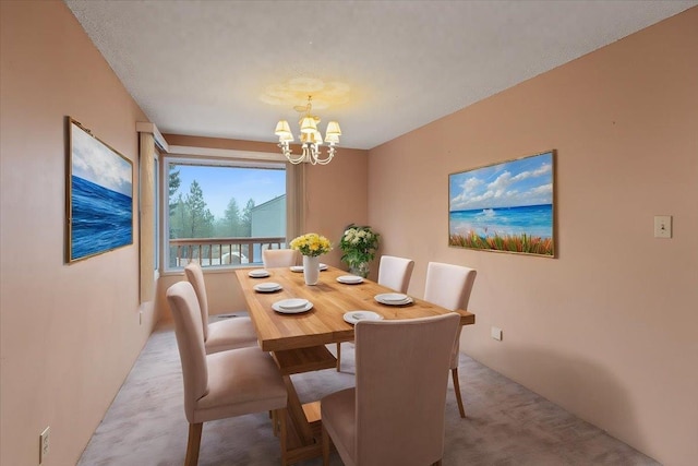 carpeted dining room featuring a chandelier