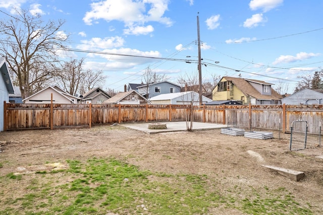 view of yard featuring a patio and a fenced backyard