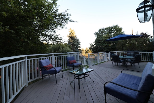 wooden deck with outdoor dining area