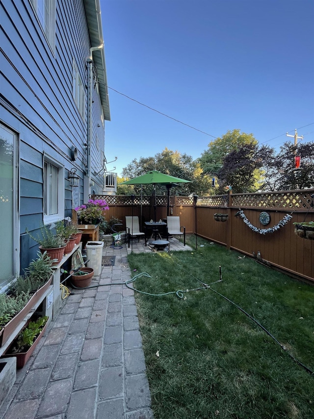 view of yard with a patio and a fenced backyard