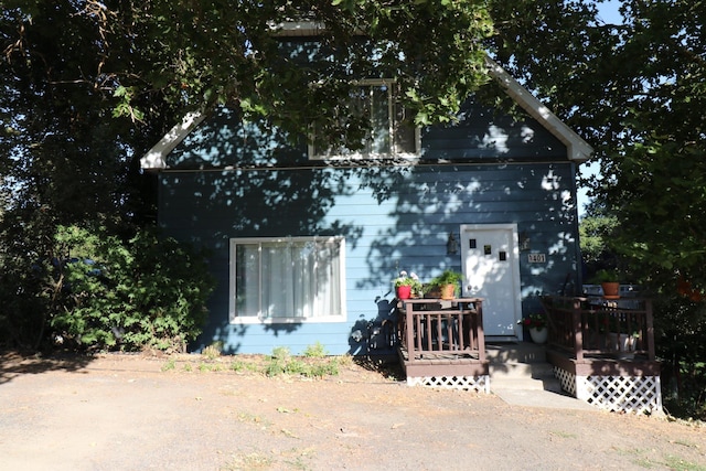 view of front of house with a wooden deck