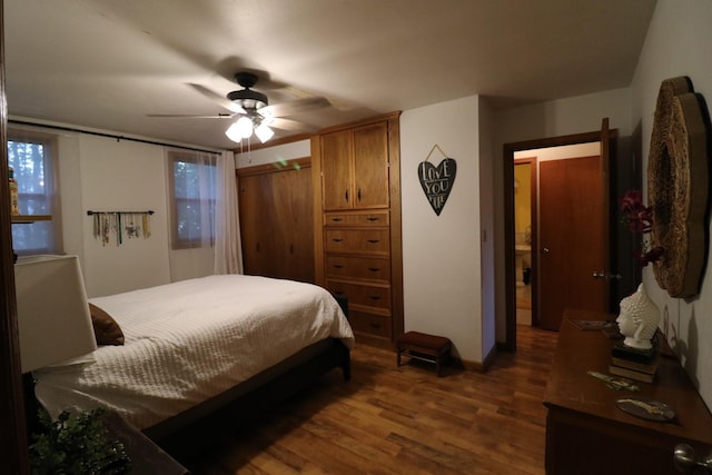 bedroom featuring dark wood-style floors and a ceiling fan